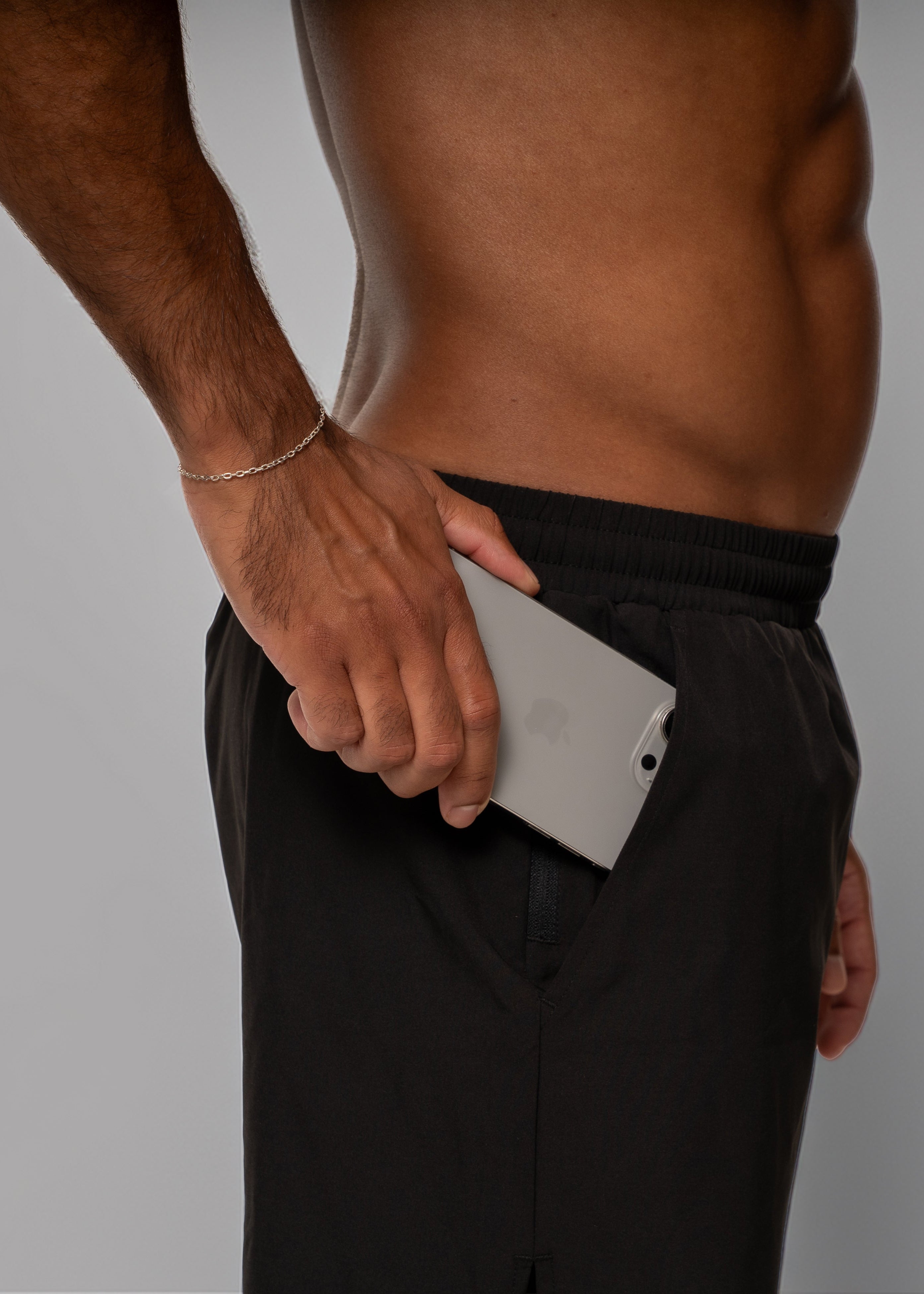 Man wearing black athletic shorts on a white background - Gymathlete 2in1 Shorts