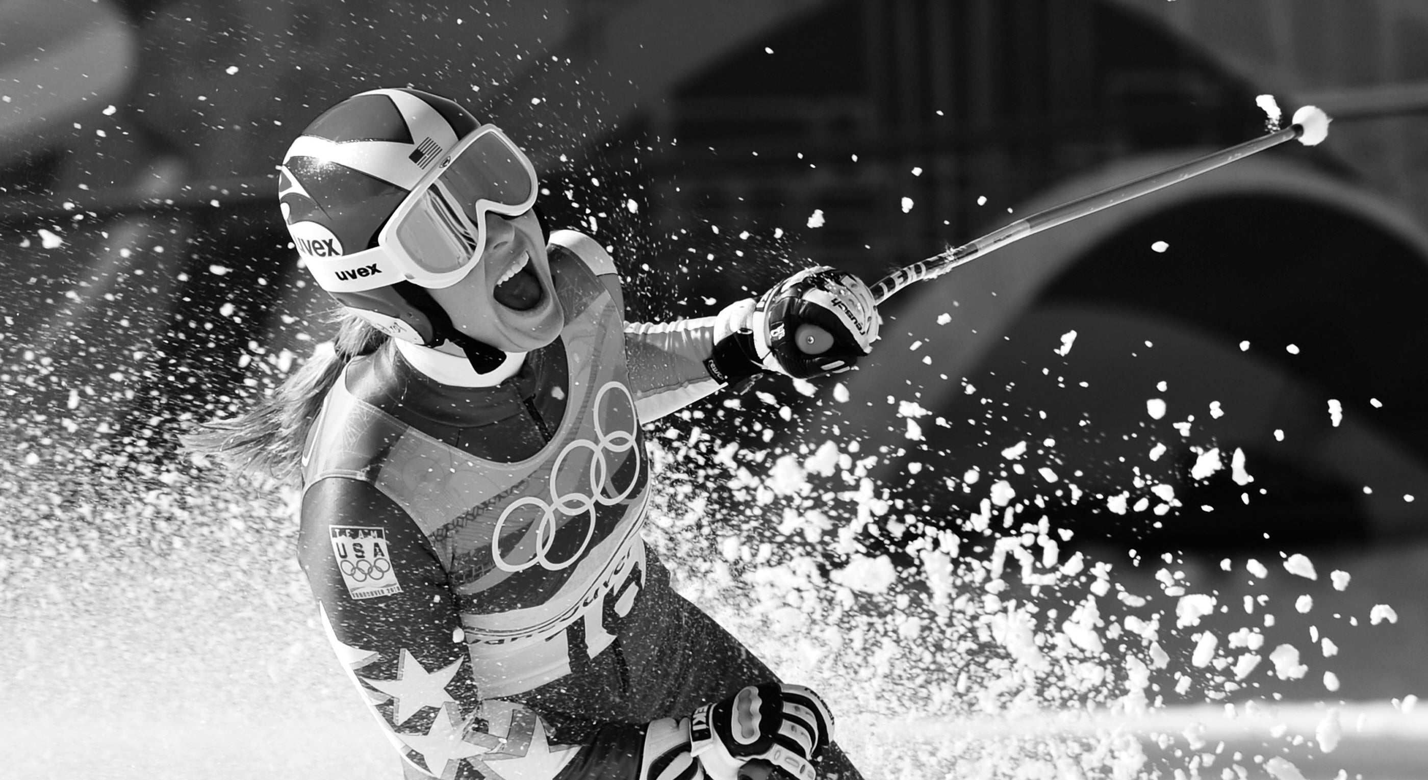 Black-and-white image of a powerful athlete celebrating a win — strength, focus, and emotion in motion. Gymathlete embodies performance with purpose