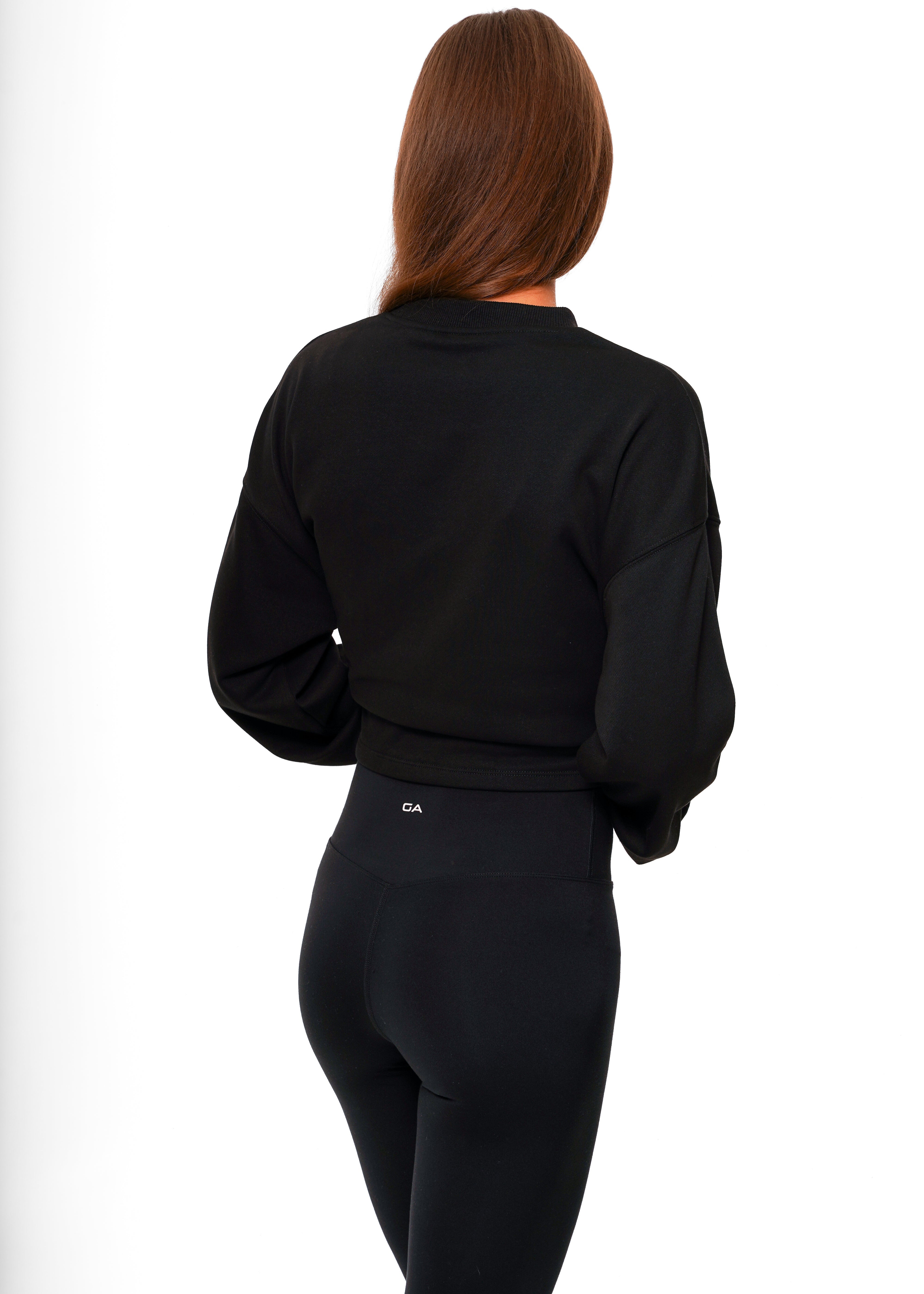 Person wearing a black outfit on a white background. Leggings - women - Pulse leggings - Gymathlete