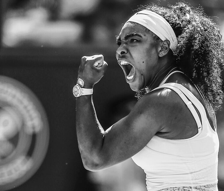 Black-and-white image of a powerful athlete celebrating a win — strength, focus, and emotion in motion. Gymathlete embodies performance with purpose