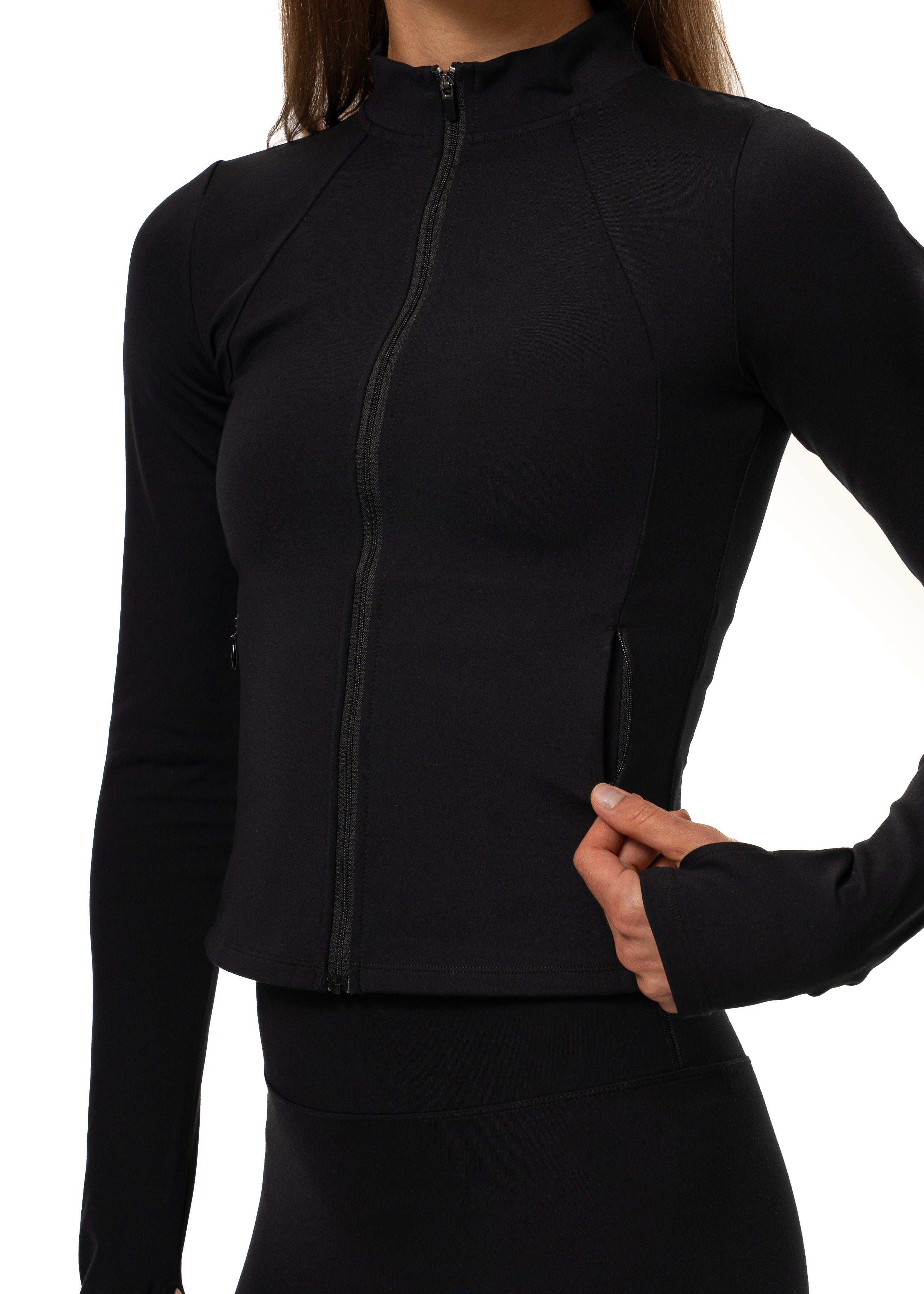 Woman wearing the Gymathlete Pulse Active Jacket in black. Activewear.