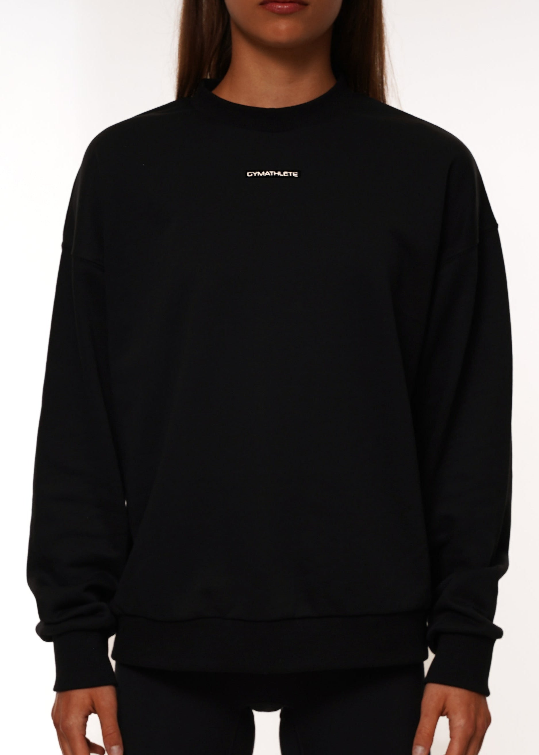 Black sweatshirt with a logo on a white background. Women - Gymathlete - Flow Sweatshirt - Black.