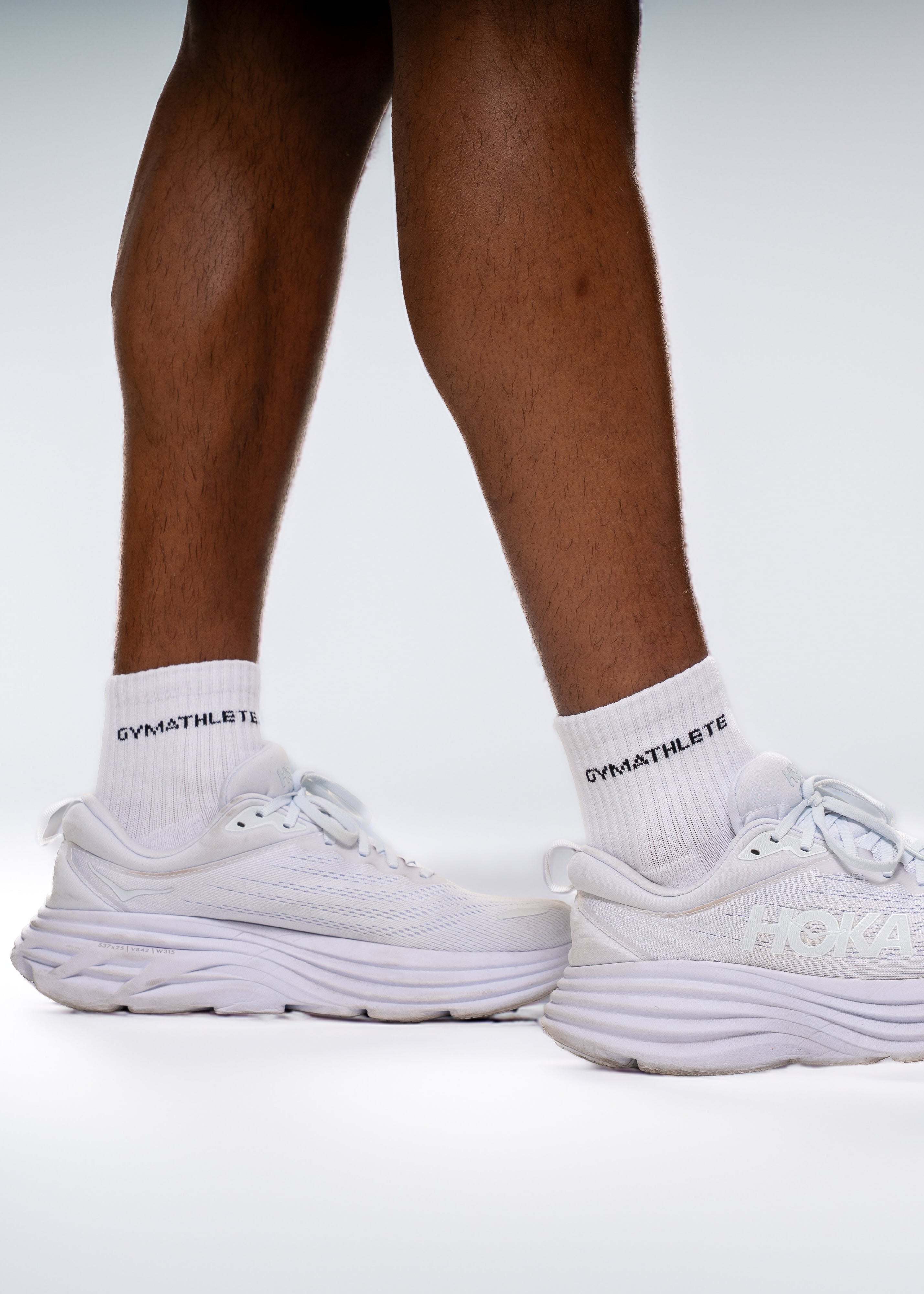 White running shoes and socks on a neutral background. Gymathlete Endurance socks - men