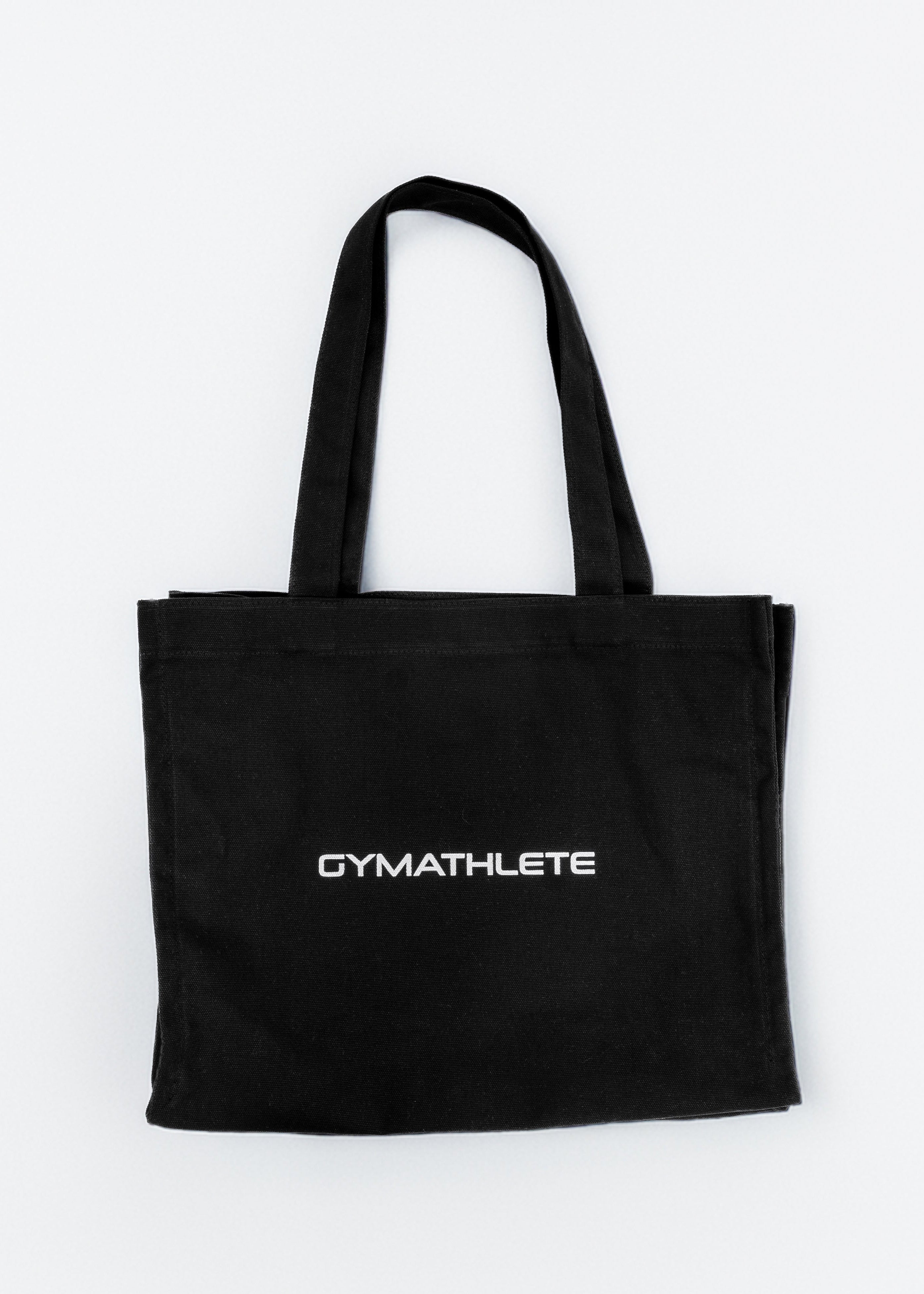 Black tote bag with 'GYMATHLETE' text on a white background. Women - Black - Gymathlete Balance Tote bag.